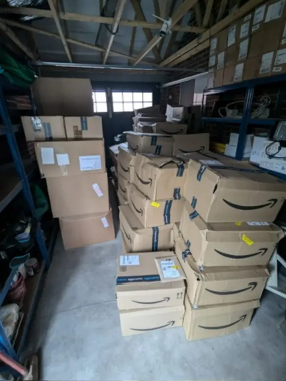 Amazon orders stacked inside the garage