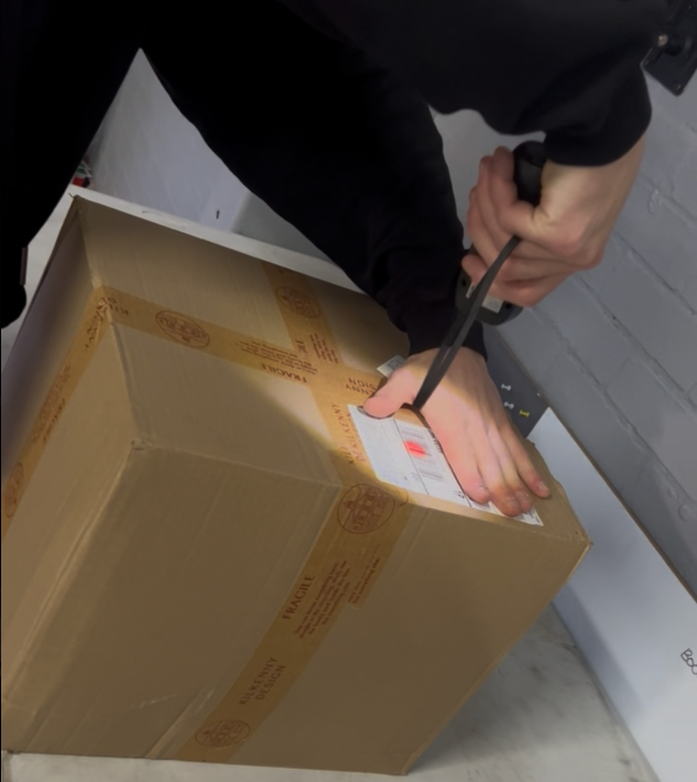 Parcel being scanned in on arrival