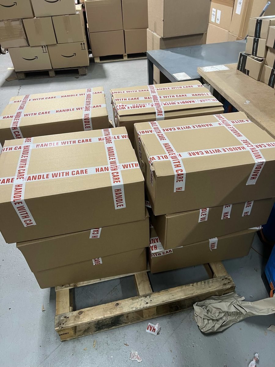 Packed and sealed FBA prep boxes ready for Amazon fulfilment